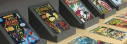 Photo: vintage comic books displayed on a table.